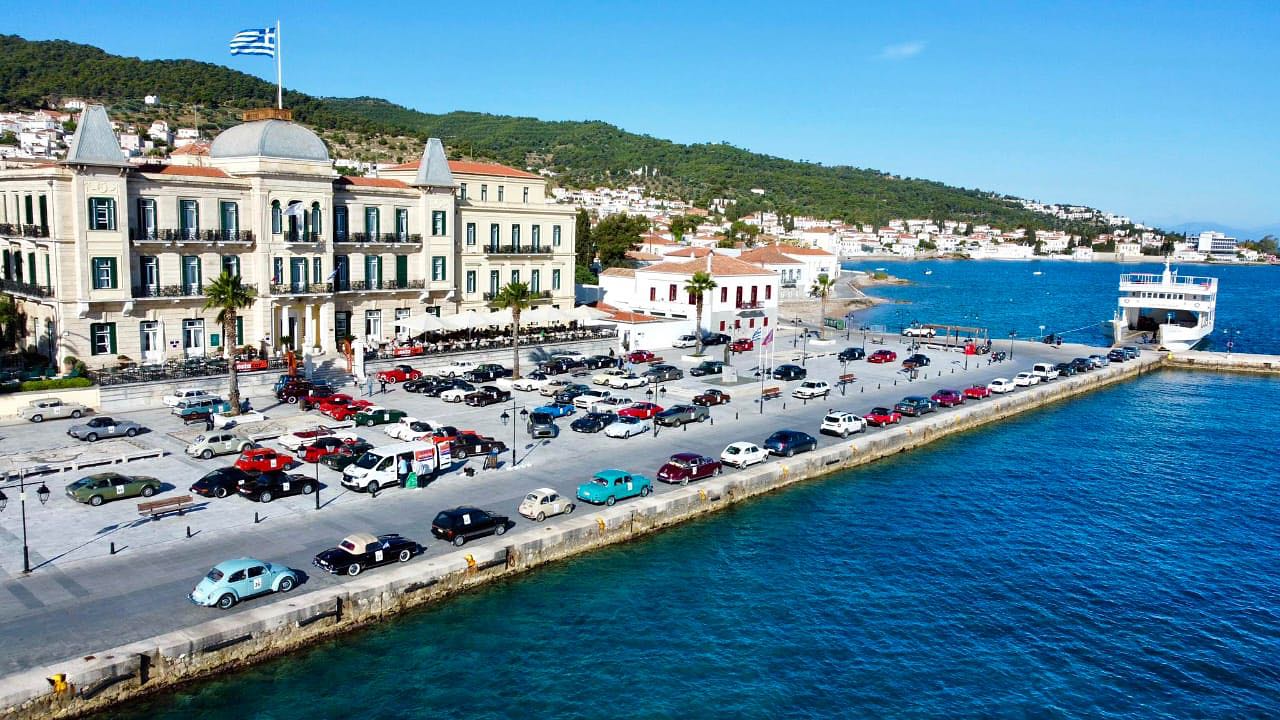antique cars in front of the Poseidonion grand hotel in Spetses