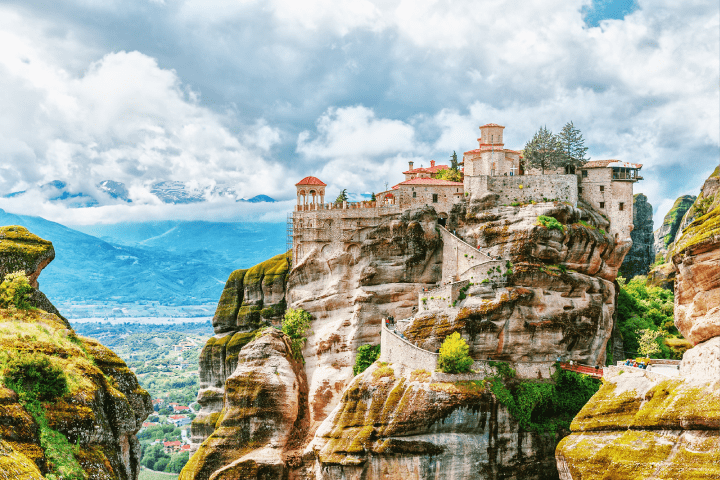 a church at the edge of a hill