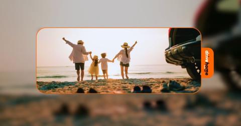 a happy family near a car by the beach